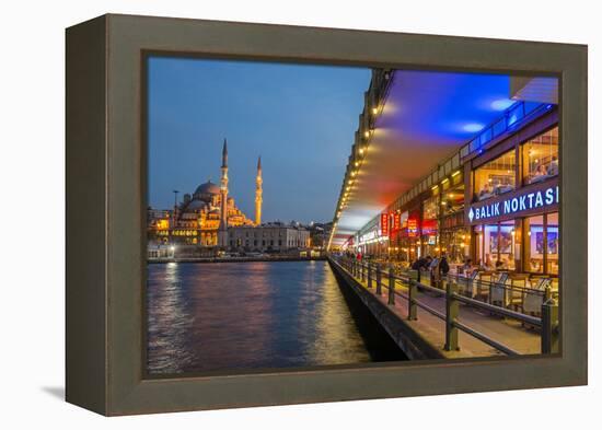 Outdoor Restaurants under Galata Bridge with Yeni Cami or New Mosque at Dusk, Istanbul-Stefano Politi Markovina-Framed Premier Image Canvas