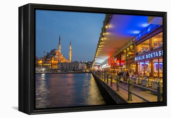 Outdoor Restaurants under Galata Bridge with Yeni Cami or New Mosque at Dusk, Istanbul-Stefano Politi Markovina-Framed Premier Image Canvas