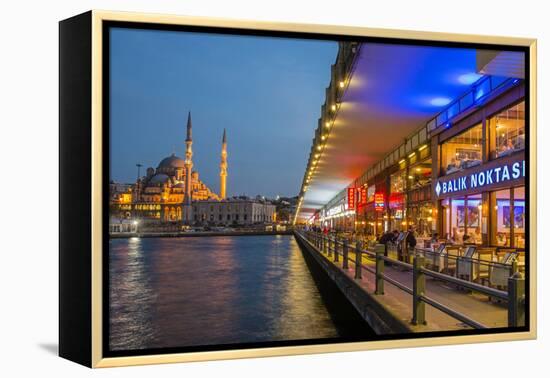 Outdoor Restaurants under Galata Bridge with Yeni Cami or New Mosque at Dusk, Istanbul-Stefano Politi Markovina-Framed Premier Image Canvas