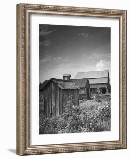 Outhouse Sitting Behind the Barn on a Farm-Bob Landry-Framed Photographic Print