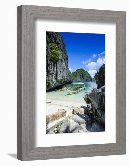 Outrigger Boat on a Little White Beach and Crystal Clear Water in the Bacuit Archipelago-Michael Runkel-Framed Photographic Print