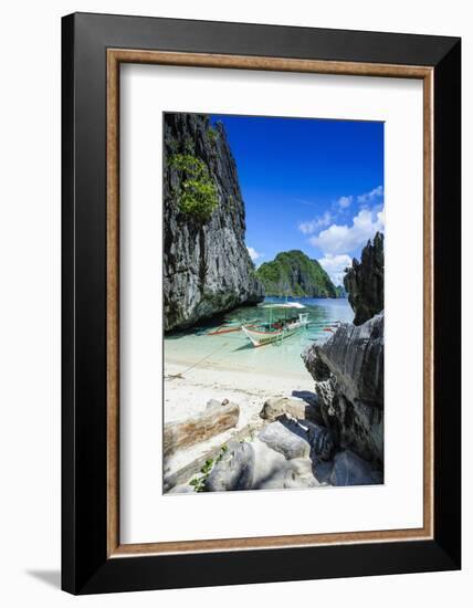 Outrigger Boat on a Little White Beach and Crystal Clear Water in the Bacuit Archipelago-Michael Runkel-Framed Photographic Print