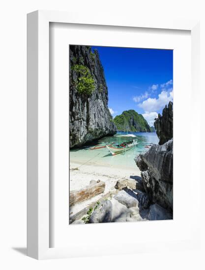 Outrigger Boat on a Little White Beach and Crystal Clear Water in the Bacuit Archipelago-Michael Runkel-Framed Photographic Print