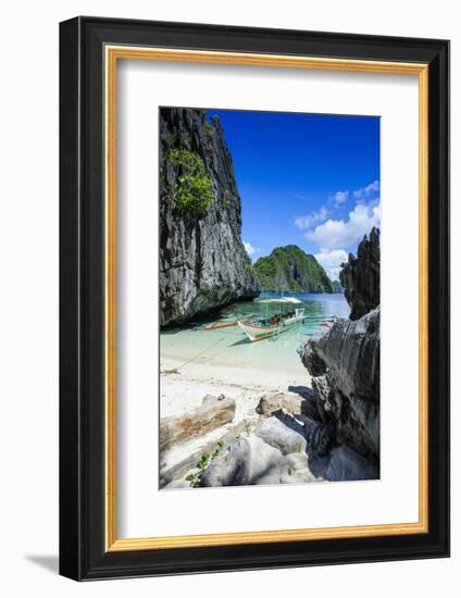 Outrigger Boat on a Little White Beach and Crystal Clear Water in the Bacuit Archipelago-Michael Runkel-Framed Photographic Print