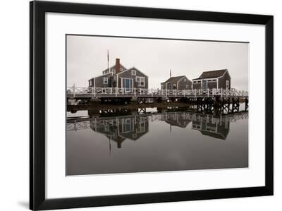 Over The Water Cottages Reflect Off The Calm Waters In The