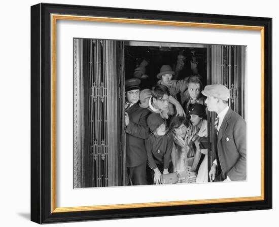 Overcrowded Elevator-null-Framed Photo