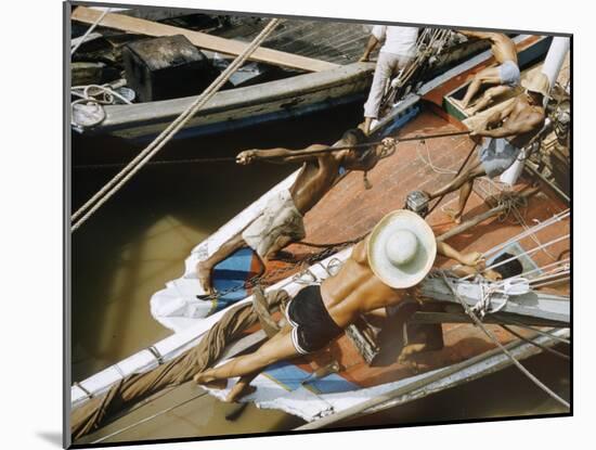 Overhead of Brazillian Men Working on a Small Cargo Boat-Dmitri Kessel-Mounted Photographic Print