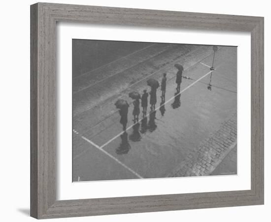 Overhead View of People with Umbrellas Waiting For the Tram, Melbourne, Australia-Emil Otto Hoppé-Framed Photographic Print