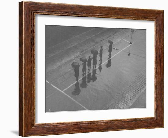 Overhead View of People with Umbrellas Waiting For the Tram, Melbourne, Australia-Emil Otto Hoppé-Framed Photographic Print