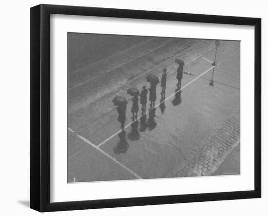 Overhead View of People with Umbrellas Waiting For the Tram, Melbourne, Australia-Emil Otto Hoppé-Framed Photographic Print