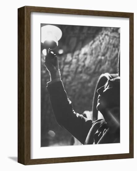 Owner of Vineyard Henri de Villaine Inspecting Wine for Clarity and Hue-Carlo Bavagnoli-Framed Photographic Print