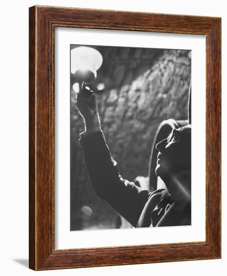 Owner of Vineyard Henri de Villaine Inspecting Wine for Clarity and Hue-Carlo Bavagnoli-Framed Photographic Print