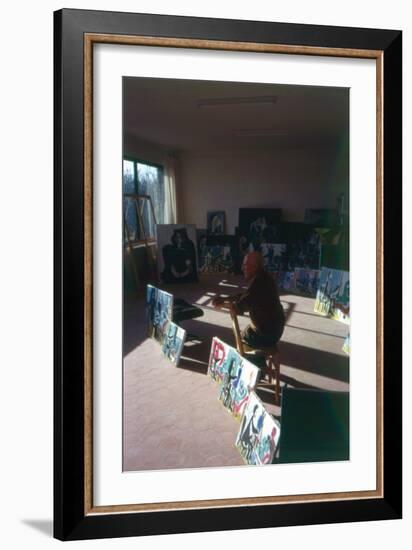 Pablo Picasso (1881-1973) in His Studio Surrounded by His Series 'Le Peintre et Son Modele'-French Photographer-Framed Photographic Print