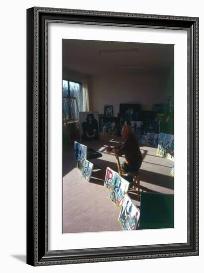 Pablo Picasso (1881-1973) in His Studio Surrounded by His Series 'Le Peintre et Son Modele'-French Photographer-Framed Photographic Print