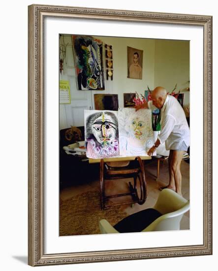 Pablo Picasso Arranging Displays of His Paintings at His Home in Notre-Dame-De-Vie, Mougins-Gjon Mili-Framed Premium Photographic Print