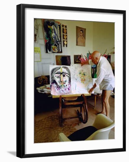 Pablo Picasso Arranging Displays of His Paintings at His Home in Notre-Dame-De-Vie, Mougins-Gjon Mili-Framed Premium Photographic Print