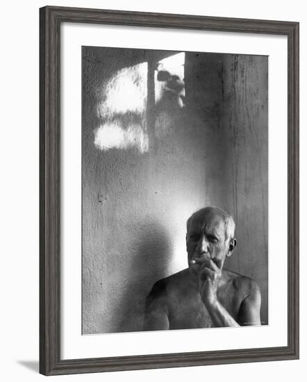 Pablo Picasso, Bare Chested and Smoking Cigarette-Gjon Mili-Framed Premium Photographic Print