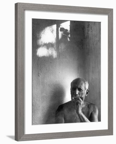 Pablo Picasso, Bare Chested and Smoking Cigarette-Gjon Mili-Framed Premium Photographic Print