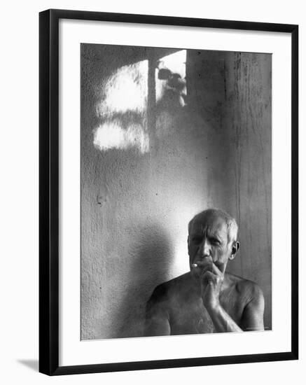 Pablo Picasso, Bare Chested and Smoking Cigarette-Gjon Mili-Framed Premium Photographic Print