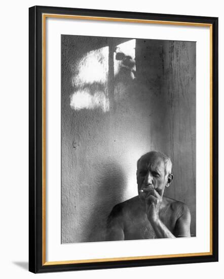 Pablo Picasso, Bare Chested and Smoking Cigarette-Gjon Mili-Framed Premium Photographic Print