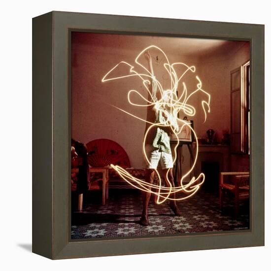 Pablo Picasso Creating Light Drawing of Vase of Flowers, Alone-Gjon Mili-Framed Premier Image Canvas