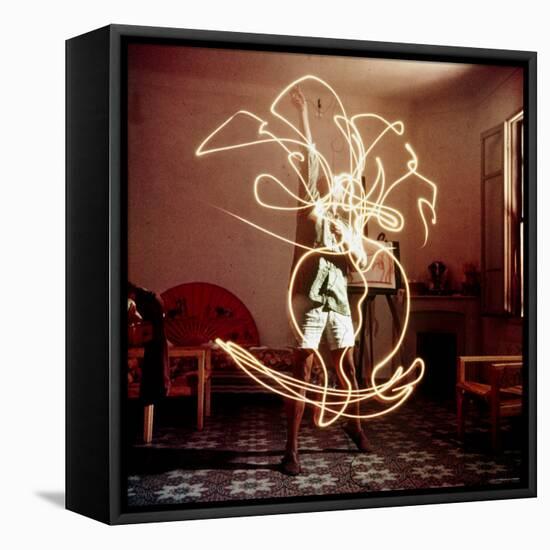 Pablo Picasso Creating Light Drawing of Vase of Flowers, Alone-Gjon Mili-Framed Premier Image Canvas