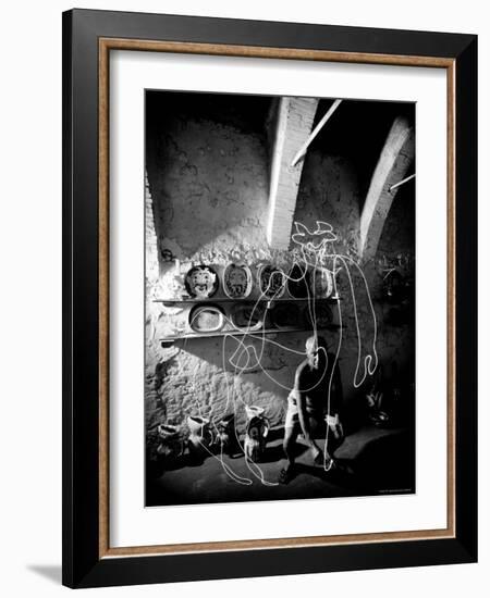 Pablo Picasso Drawing a Centaur in the Air with a Flashlight at Madoura Pottery-Gjon Mili-Framed Premium Photographic Print