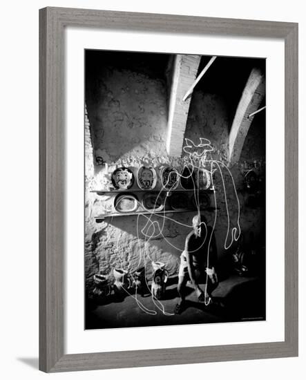 Pablo Picasso Drawing a Centaur in the Air with a Flashlight at Madoura Pottery-Gjon Mili-Framed Premium Photographic Print