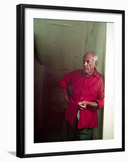 Pablo Picasso Leaning Against Wall and Holding Smoldering Cigarette-Gjon Mili-Framed Premium Photographic Print