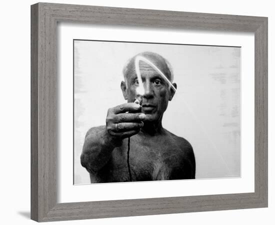 Pablo Picasso Using Flashlight to Begin Making Light Drawing in the Air-Gjon Mili-Framed Premium Photographic Print