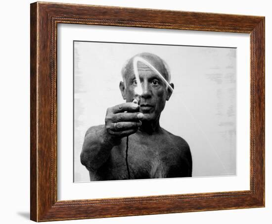 Pablo Picasso Using Flashlight to Begin Making Light Drawing in the Air-Gjon Mili-Framed Premium Photographic Print