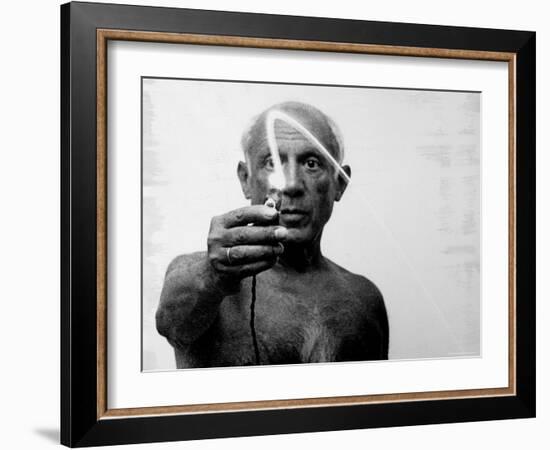 Pablo Picasso Using Flashlight to Begin Making Light Drawing in the Air-Gjon Mili-Framed Premium Photographic Print