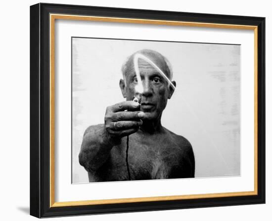 Pablo Picasso Using Flashlight to Begin Making Light Drawing in the Air-Gjon Mili-Framed Premium Photographic Print