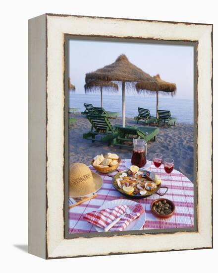 Paella with Olives, Bread and Sangria on a Table on the Beach in Andalucia, Spain-Michael Busselle-Framed Premier Image Canvas