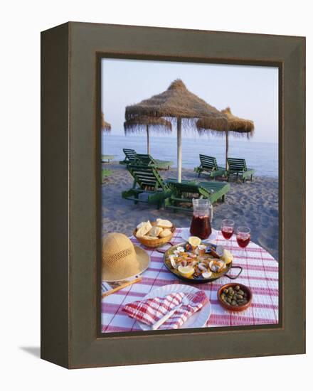 Paella with Olives, Bread and Sangria on a Table on the Beach in Andalucia, Spain-Michael Busselle-Framed Premier Image Canvas