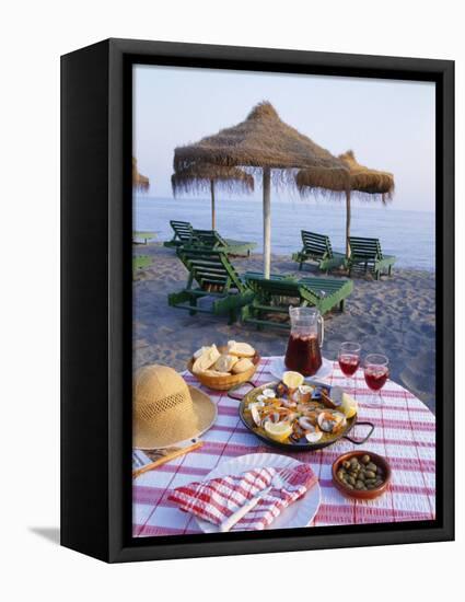 Paella with Olives, Bread and Sangria on a Table on the Beach in Andalucia, Spain-Michael Busselle-Framed Premier Image Canvas