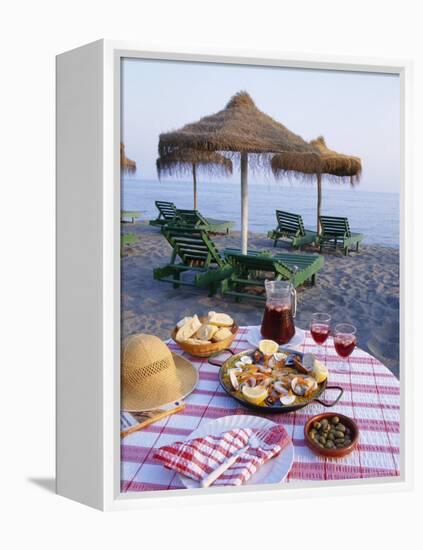 Paella with Olives, Bread and Sangria on a Table on the Beach in Andalucia, Spain-Michael Busselle-Framed Premier Image Canvas