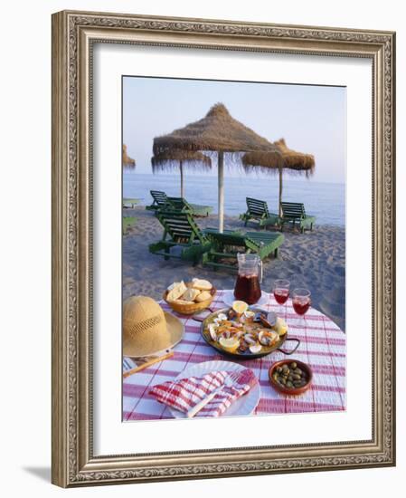 Paella with Olives, Bread and Sangria on a Table on the Beach in Andalucia, Spain-Michael Busselle-Framed Photographic Print