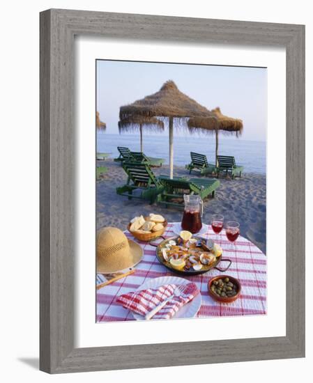 Paella with Olives, Bread and Sangria on a Table on the Beach in Andalucia, Spain-Michael Busselle-Framed Photographic Print