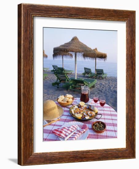 Paella with Olives, Bread and Sangria on a Table on the Beach in Andalucia, Spain-Michael Busselle-Framed Photographic Print