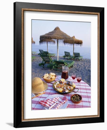 Paella with Olives, Bread and Sangria on a Table on the Beach in Andalucia, Spain-Michael Busselle-Framed Photographic Print