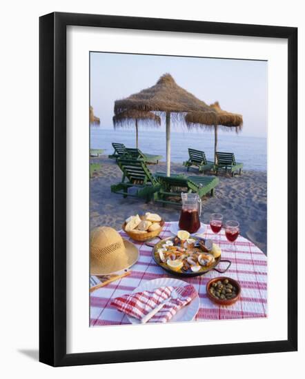 Paella with Olives, Bread and Sangria on a Table on the Beach in Andalucia, Spain-Michael Busselle-Framed Photographic Print