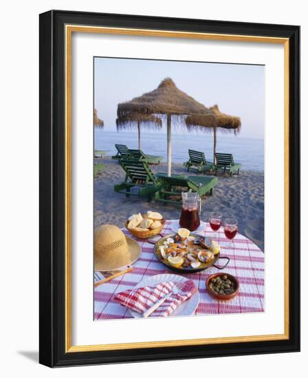 Paella with Olives, Bread and Sangria on a Table on the Beach in Andalucia, Spain-Michael Busselle-Framed Photographic Print