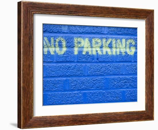 Painted Blue Brick Wall with No Parking Sign-John Nordell-Framed Photographic Print