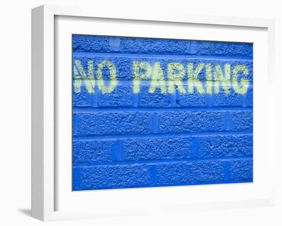 Painted Blue Brick Wall with No Parking Sign-John Nordell-Framed Photographic Print