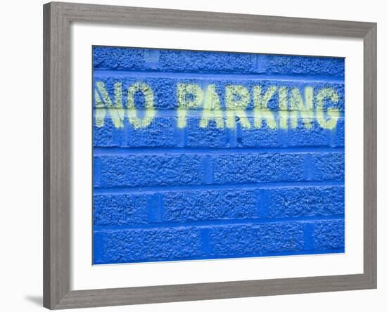 Painted Blue Brick Wall with No Parking Sign-John Nordell-Framed Photographic Print