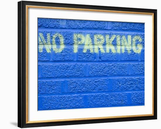 Painted Blue Brick Wall with No Parking Sign-John Nordell-Framed Photographic Print