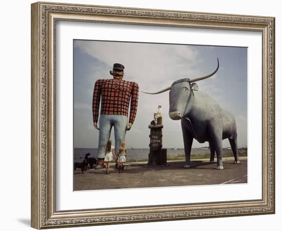 Painted Concrete Sculpture of Paul Bunyon and His Blue Ox, Babe Standing on Shores of Lake Bemidji-Andreas Feininger-Framed Photographic Print