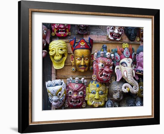 Painted face masks on display in the historical Newar city of Bhaktapur, Nepal, Asia-Alex Treadway-Framed Photographic Print