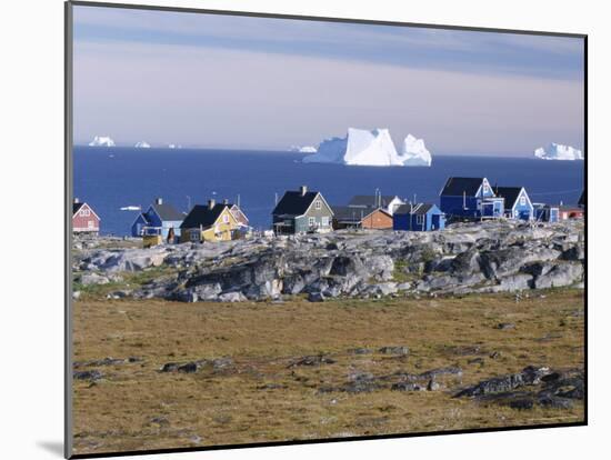Painted Village Houses in Front of Icebergs in Disko Bay, West Coast, Greenland-Anthony Waltham-Mounted Photographic Print